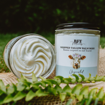 BFF Naturals whipped tallow balm body product with a cow on the label, placed outdoors.